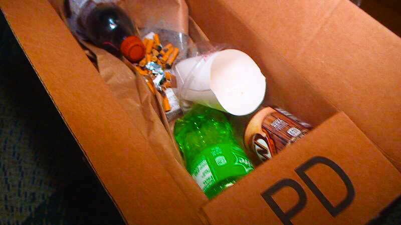 pirate trap-kitty litter-trash Porch pirate suprise box filled with trash, kitty little, cigarette butts.