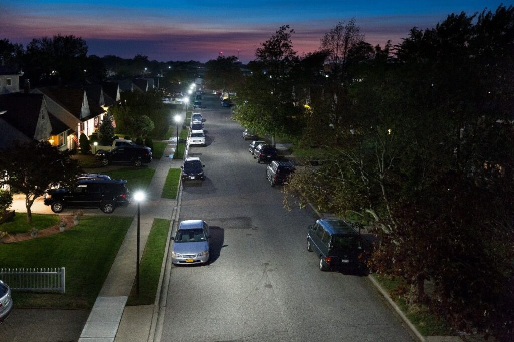 Parked cars on suburban neighborhood Cars parked along both sides of a suburban residential neighborhood.