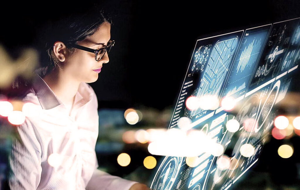 2025 Security Technology Trends Woman working at a computer bay with screen reflections