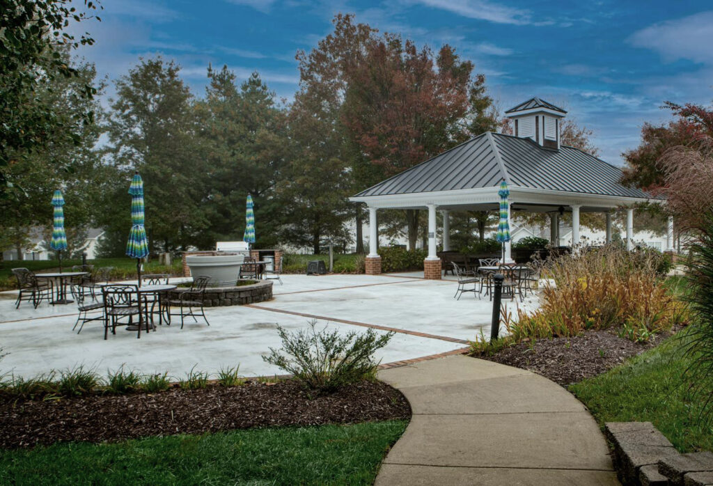 HOA Clubhouse-Benefits of Security Cameras an HOA Clubhouse and patio with landscaped shrubs