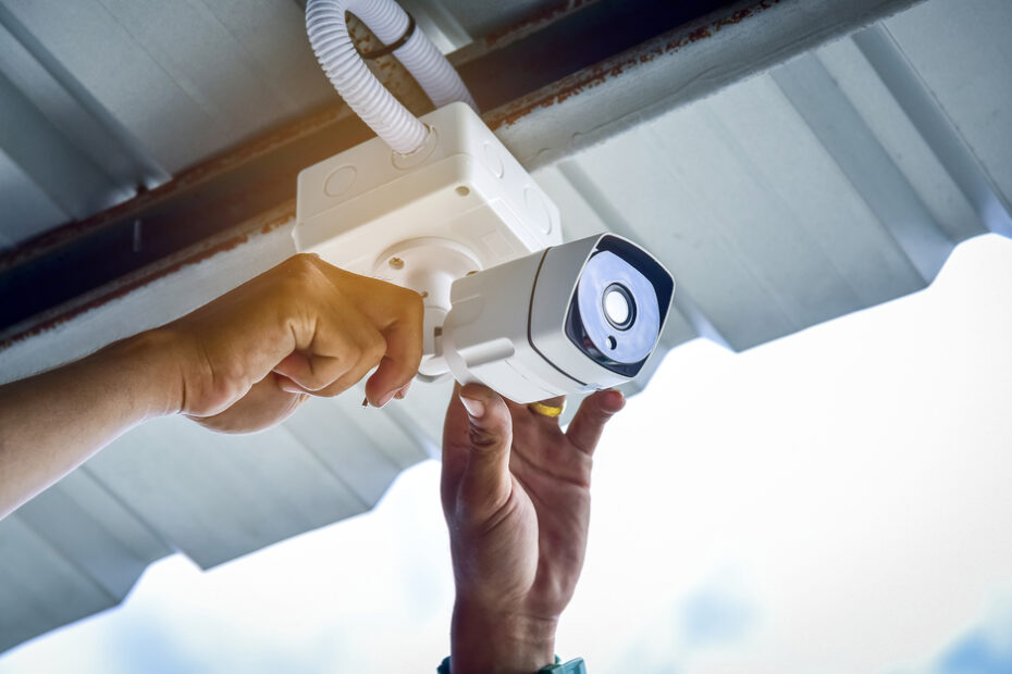 Security camera being installed on a home.